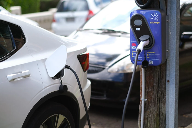 An EV plugged into a public charger