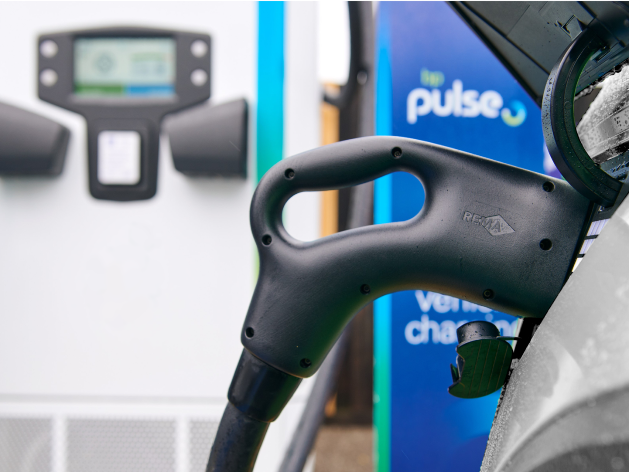 An electric car charging at a BP pulse station
